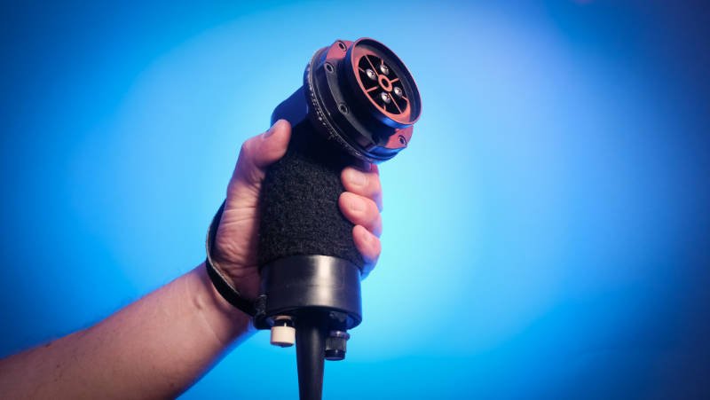 Vibracussor Chiropractic Massage Tool In Hands Of A Chiropractor